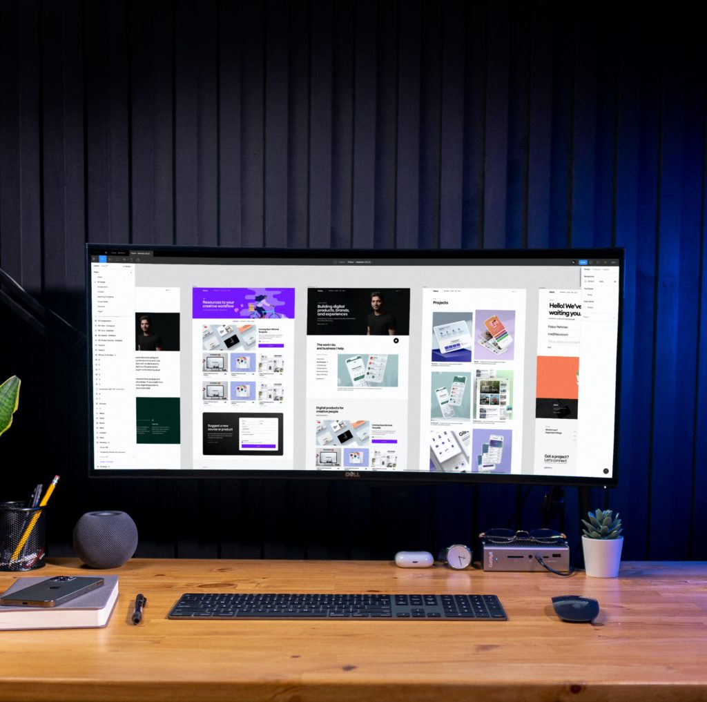 web designs created in Figma on display on a remote work station